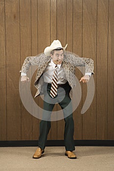 Man wearing cowboy hat dancing.