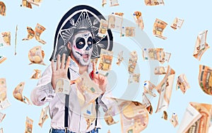 Man wearing day of the dead costume over background afraid and terrified with fear expression stop gesture with hands, shouting in