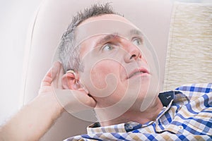 Man wearing deaf aid