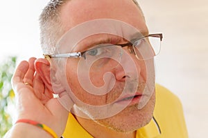 Man wearing deaf aid