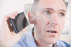 Man wearing deaf aid