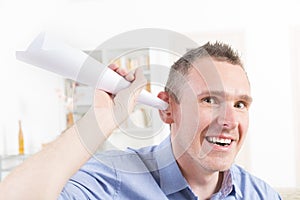 Man wearing deaf aid trying to hear something