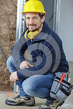 man wearing ear muff smiling close-up photo