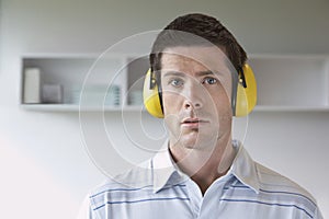 Man Wearing Ear Protectors In Office