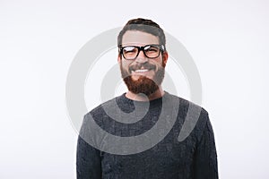 Man wearing eyeglasses smiling and looking confident at the camera