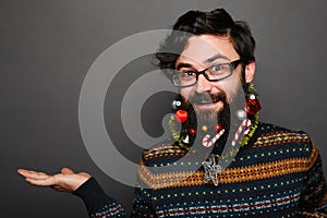 Man wearing eyewear showing something on the palm