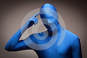 Man Wearing Full Blue Nylon Bodysuite Scratching H