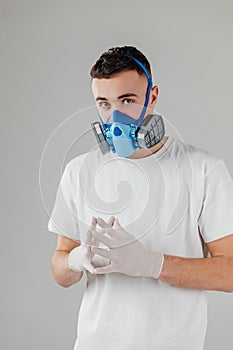 Man wearing full-Face Respirator protective gas mask against virus, radiation, bacteria and dust. Professional mask