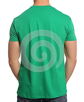 Man wearing green t-shirt on white background, back view. Mockup for design