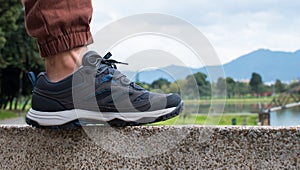 Man wearing grey trekking shoes