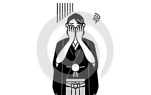 Man wearing Hakama with crest covering his face in depression