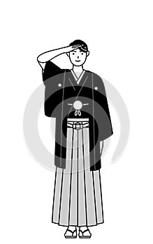 Man wearing Hakama with crest making a salute