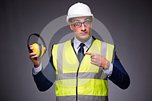 The man wearing hard hat and construction vest