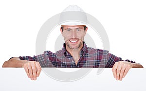 Man Wearing Hard Hat Holding Placard photo