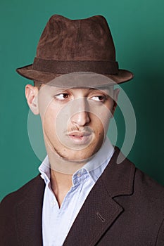 Man wearing a hat and looking aside