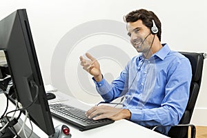 Man wearing headset giving online chat and support