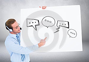 Man wearing headset holding card with speech bubble graphics drawings