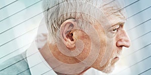 Man wearing hearing aid, geometric pattern