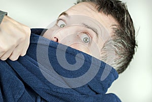 Man Wearing Housecoat Being Yanked Off Camera photo