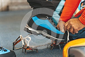 Man wearing the ice climbing crampons