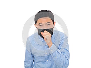 Man wearing a mask coughs vigorously in front of a white background