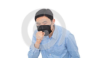 Man wearing a mask coughs vigorously in front of a white background