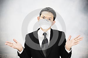 Man wearing mask protect fine dust in air pollution environment