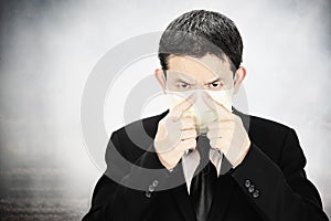 Man wearing mask protect fine dust in air pollution environment