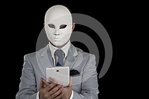 Man wearing mask texting on smart phone,