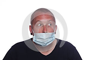 Man wearing a medical protective face mask incorrectly