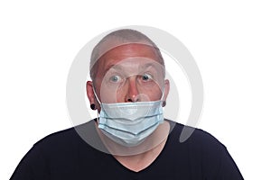 Man wearing a medical protective face mask incorrectly photo