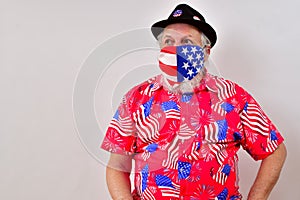 Man wearing patriotic shirt and face mask