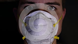 Man Wearing a Protective Dust Mask Up Close