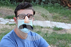 Man wearing protective mask with funny complements