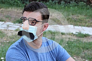 Man wearing protective mask with funny complements