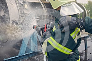Man wearing protective uniform learning with fire equipment