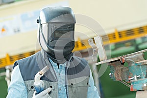 man wearing protective welding mask