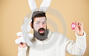 Man wearing rabbit suit. Funny bunny man soft ears. Easter activities concept. Weirdo concept. Celebrate Easter. Guy