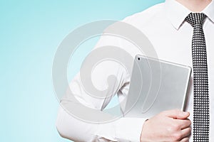 Man wearing shirt and tie with tablet pc photo