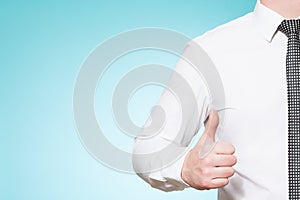 Man wearing shirt and tie thumbs up