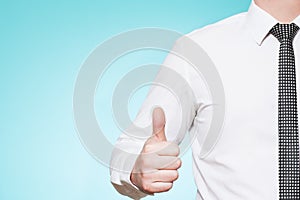 Man wearing shirt and tie thumbs up photo
