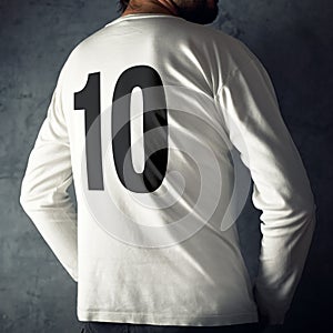 Man wearing sport shirt with number ten