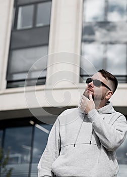Man wearing stylish gray hoodie