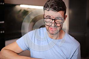 Man wearing three different types of eyeglasses simultaneously photo