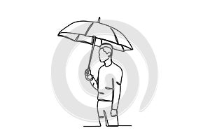 A man wearing an umbrella avoids the sun