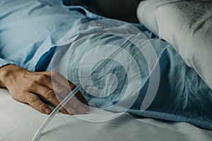 man wearing a urinary catheterization in bed