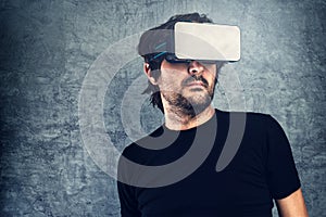 Man wearing virtual reality goggles for 3d VR multimedia content