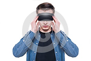 Man wearing virtual reality goggles isolated on white background