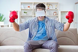 The man wearing virtual reality vr glasses playing boxing game
