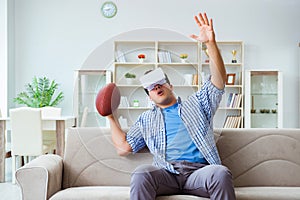 Man wearing virtual reality VR glasses watching american footbal